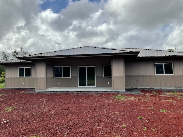 back of house with a patio