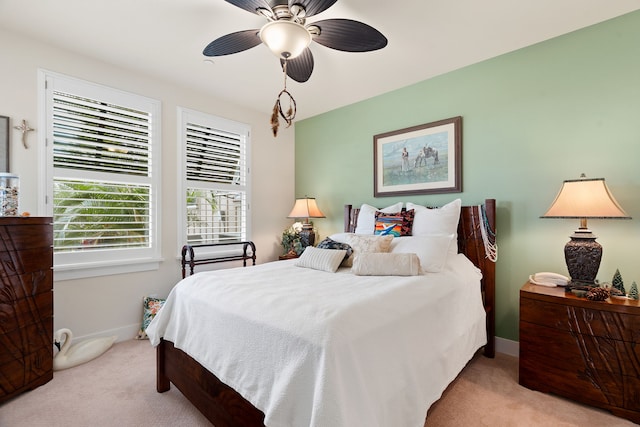 bedroom featuring ceiling fan and light colored carpet