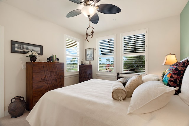 bedroom with ceiling fan and carpet floors