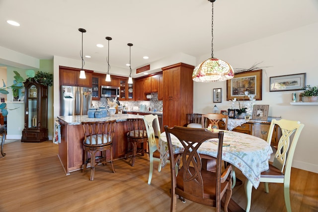 dining space featuring light hardwood / wood-style flooring