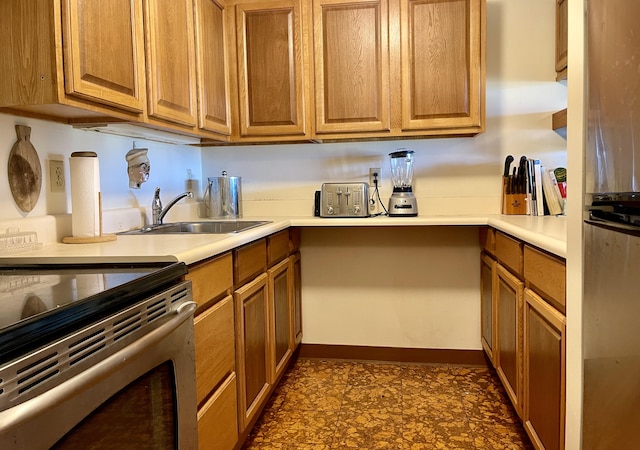 kitchen with sink and stainless steel range