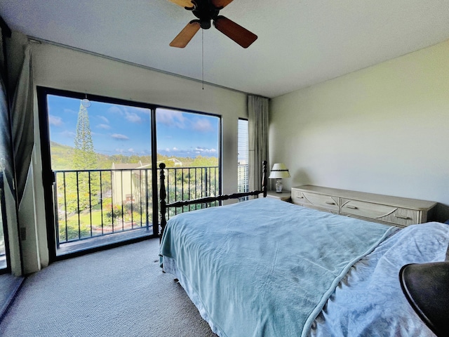 carpeted bedroom featuring access to outside and ceiling fan