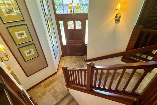 entryway featuring a chandelier