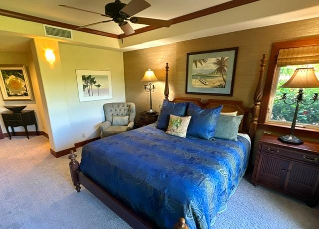 bedroom featuring light carpet, ceiling fan, and ornamental molding