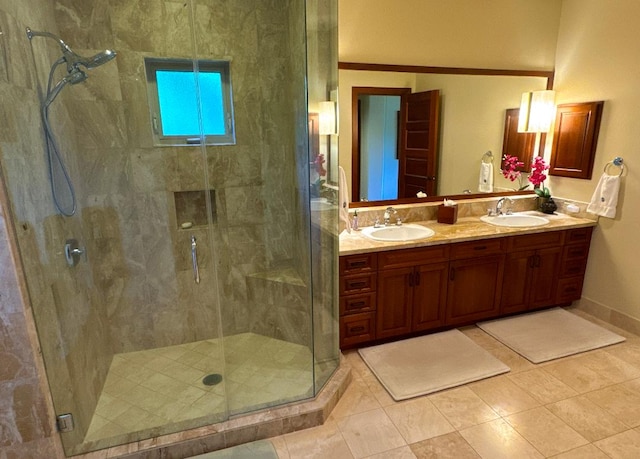 bathroom featuring tile patterned floors, vanity, and an enclosed shower