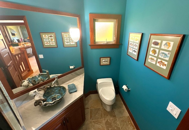 bathroom with vanity and toilet