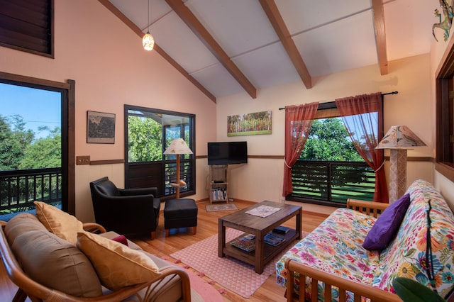 living room featuring beamed ceiling, wood-type flooring, and high vaulted ceiling