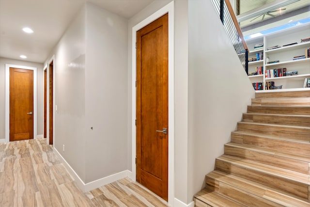 staircase featuring wood-type flooring