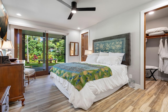 bedroom featuring access to outside, ceiling fan, a closet, and light hardwood / wood-style floors