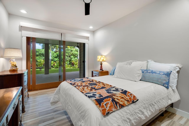 bedroom featuring light wood-type flooring, access to outside, and ceiling fan