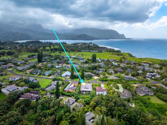 birds eye view of property featuring a water and mountain view