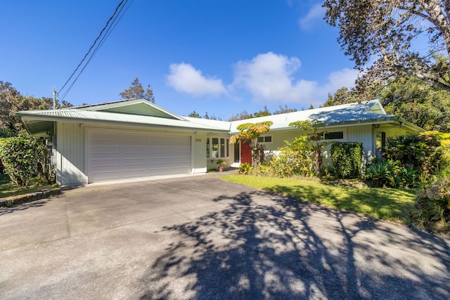 ranch-style home with a garage