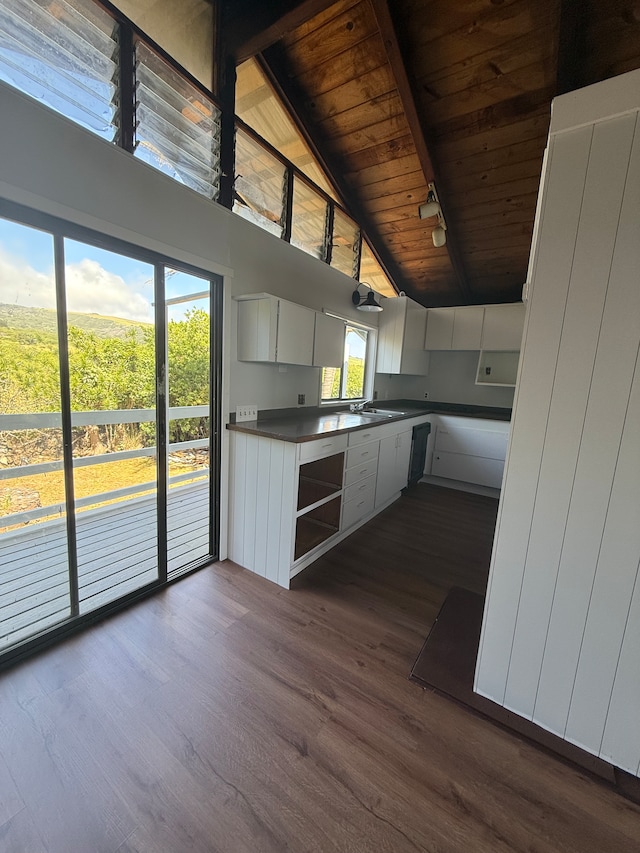 interior space with plenty of natural light and wood walls