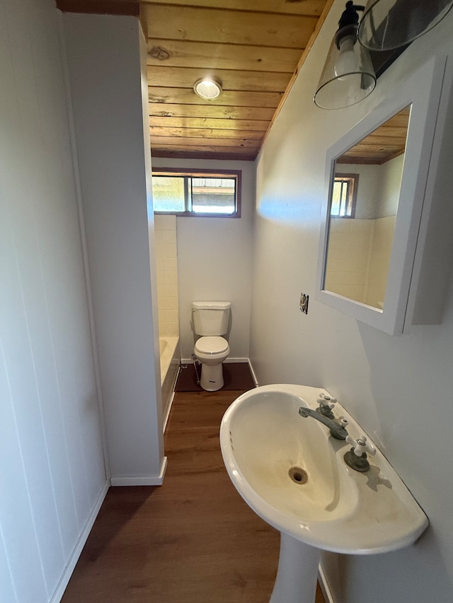 bathroom featuring wood walls