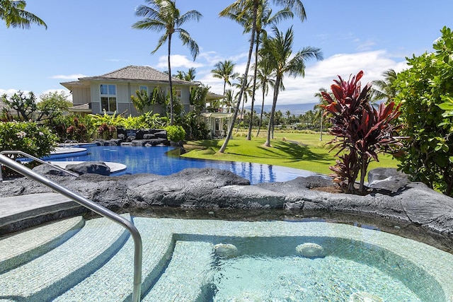 view of pool featuring a yard