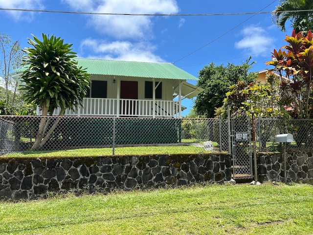 view of front of house featuring a front yard and a porch