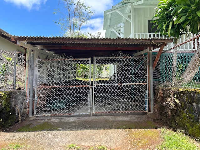 view of gate with a carport