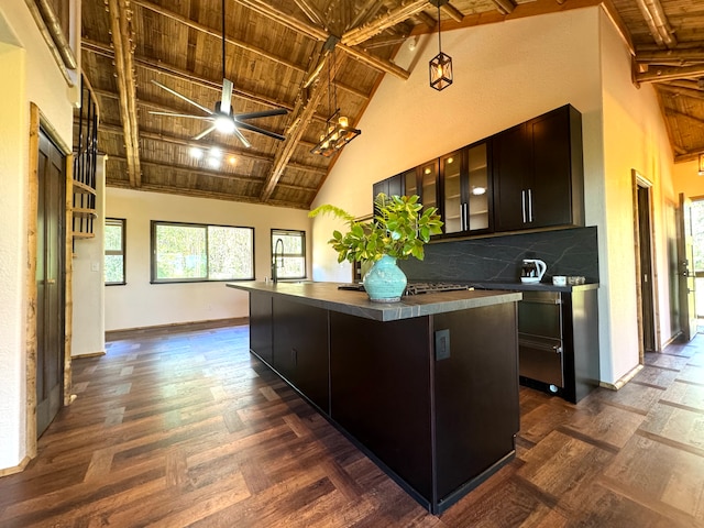 kitchen with a kitchen island, wooden ceiling, beam ceiling, and high vaulted ceiling