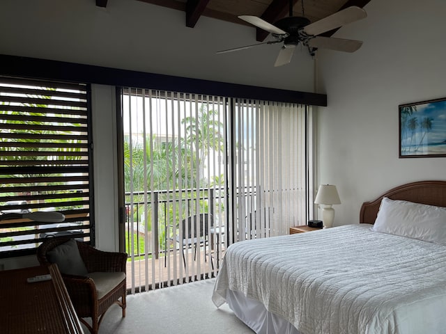 carpeted bedroom with access to outside, multiple windows, ceiling fan, and beam ceiling