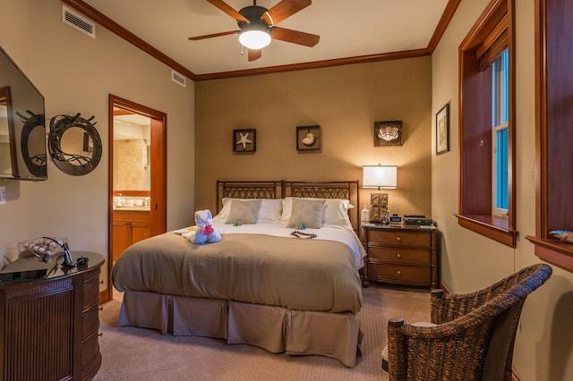 bedroom with light carpet, ceiling fan, ensuite bathroom, and ornamental molding