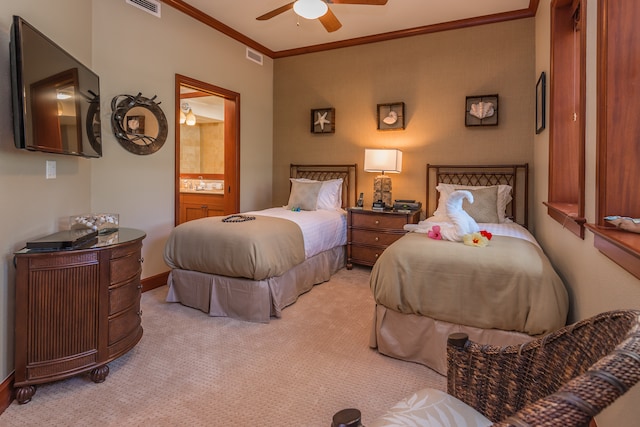 carpeted bedroom with ensuite bath, ceiling fan, and ornamental molding