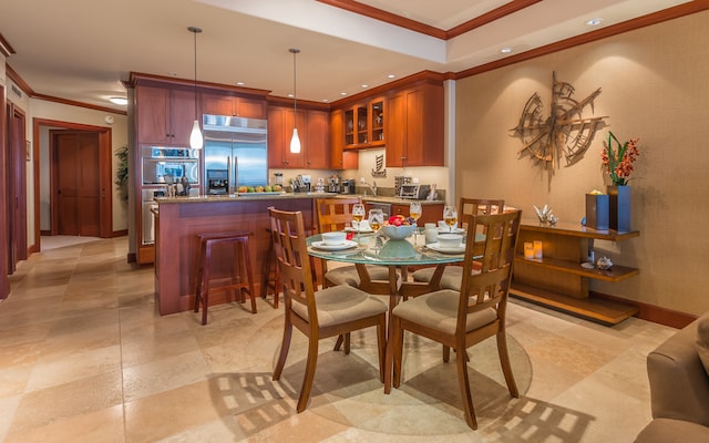 dining space with crown molding