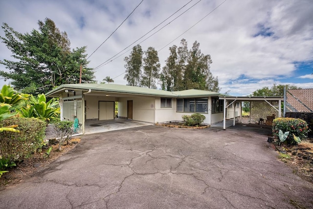 view of front of property with a carport