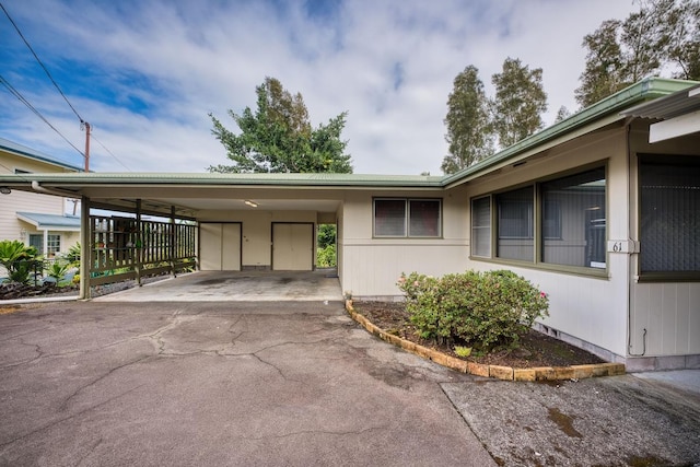 exterior space with a carport