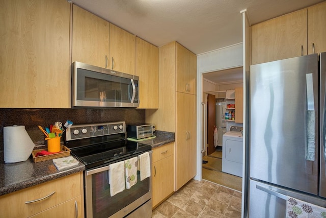 kitchen featuring light brown cabinets, washer / clothes dryer, and appliances with stainless steel finishes