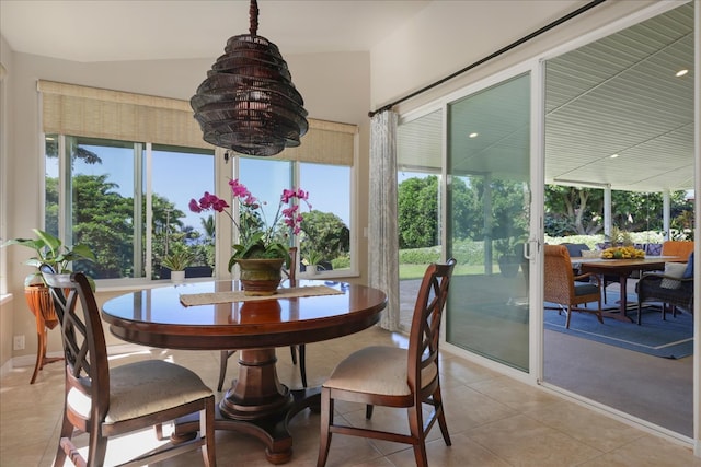 sunroom featuring lofted ceiling