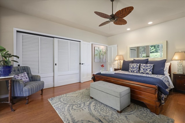 bedroom with ceiling fan and hardwood / wood-style floors