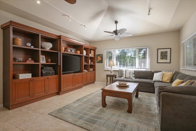 tiled living room with rail lighting, vaulted ceiling, and ceiling fan