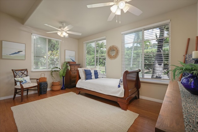 bedroom with ceiling fan and wood-type flooring