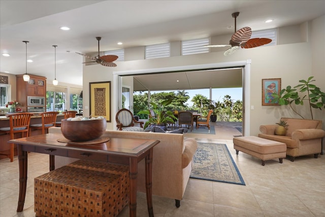 living room featuring ceiling fan and light tile patterned floors