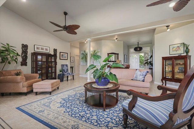 living room featuring ceiling fan, light tile patterned floors, and vaulted ceiling