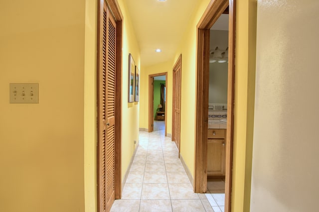 hall with light tile patterned flooring