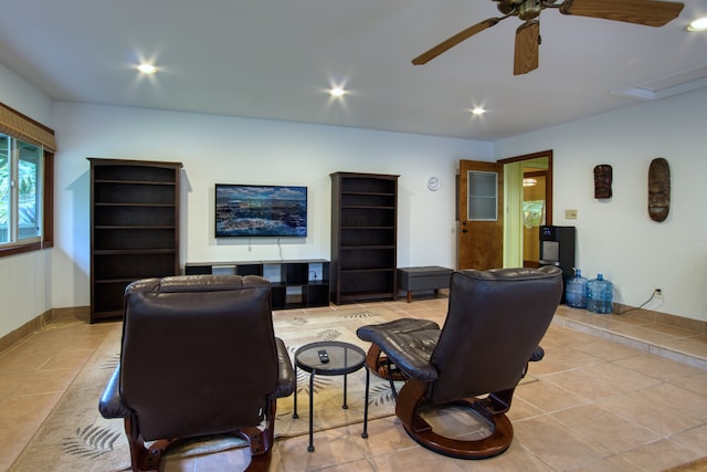 living room with light tile patterned floors and ceiling fan