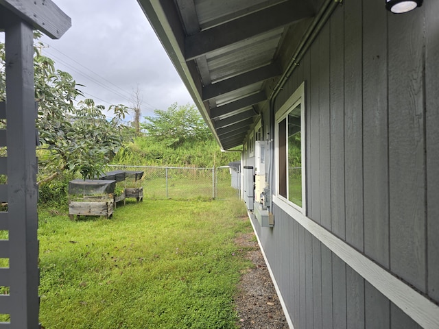 view of yard with a vegetable garden and fence