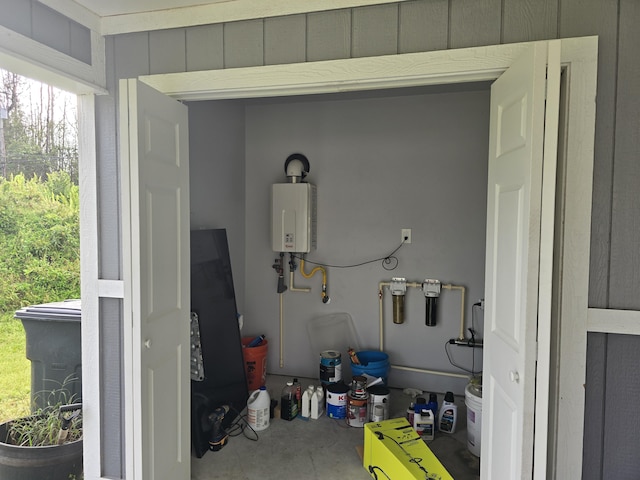 utility room featuring water heater