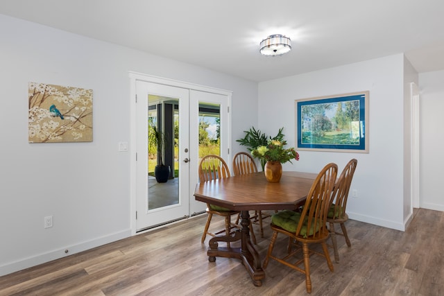 dining room featuring light hardwood / wood-style floors and french doors