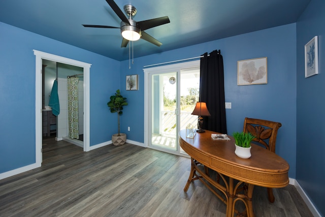 dining room featuring ceiling fan and dark wood-type flooring