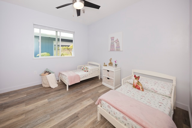 bedroom featuring ceiling fan and hardwood / wood-style floors