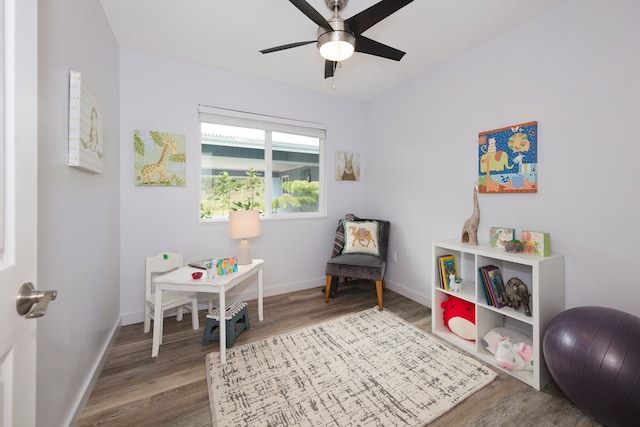 interior space with ceiling fan and hardwood / wood-style flooring