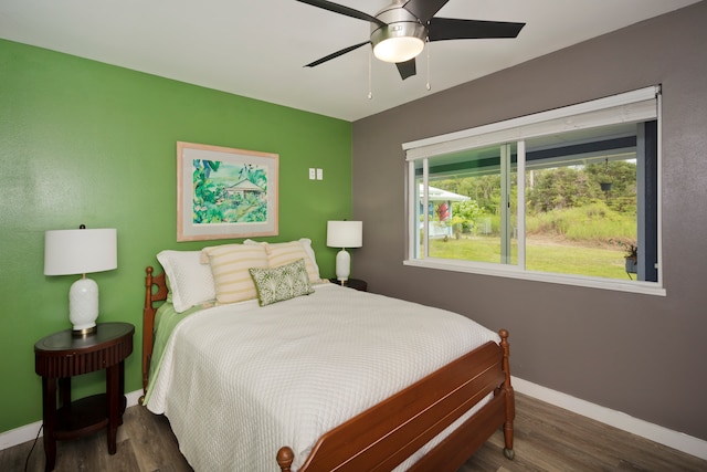 bedroom featuring ceiling fan and dark hardwood / wood-style flooring