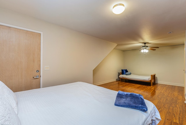 bedroom with wood-type flooring, vaulted ceiling, and ceiling fan