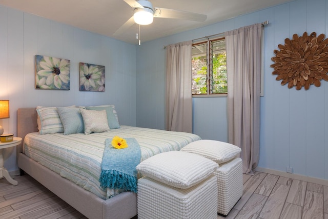 bedroom with light hardwood / wood-style flooring and ceiling fan