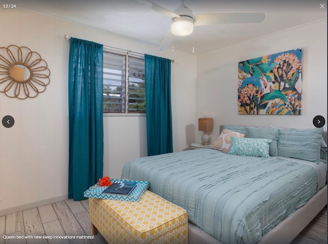 bedroom featuring hardwood / wood-style flooring and ceiling fan