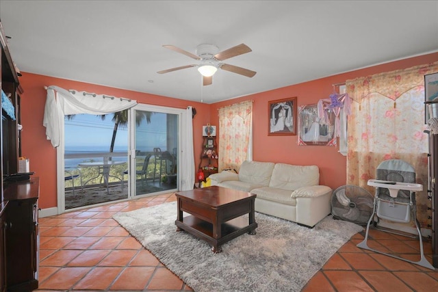 living room featuring ceiling fan and tile patterned flooring