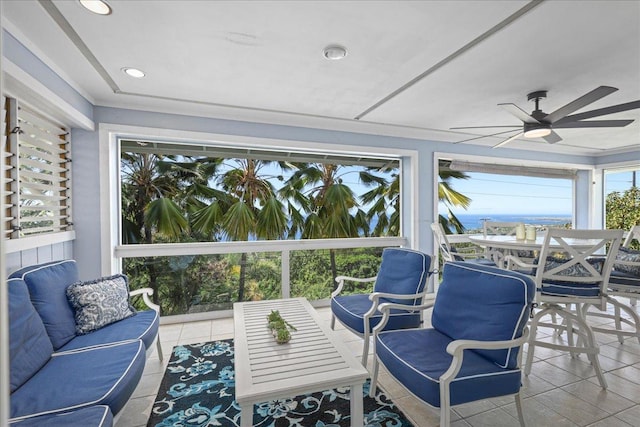 sunroom featuring ceiling fan and a healthy amount of sunlight