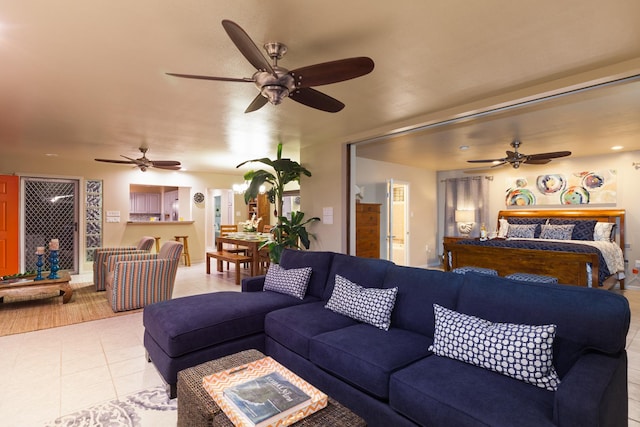 living room featuring tile patterned floors and ceiling fan